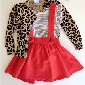 Orange/red suspender jumper skirt with buttons